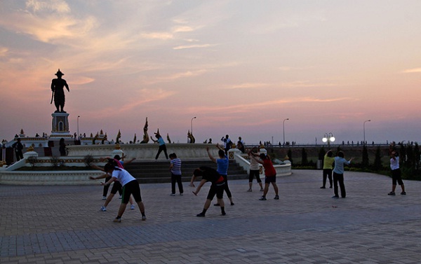 Groups of locals practice Tai Chi in Vientiane