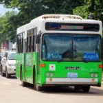 The typical green and white bus in Laos
